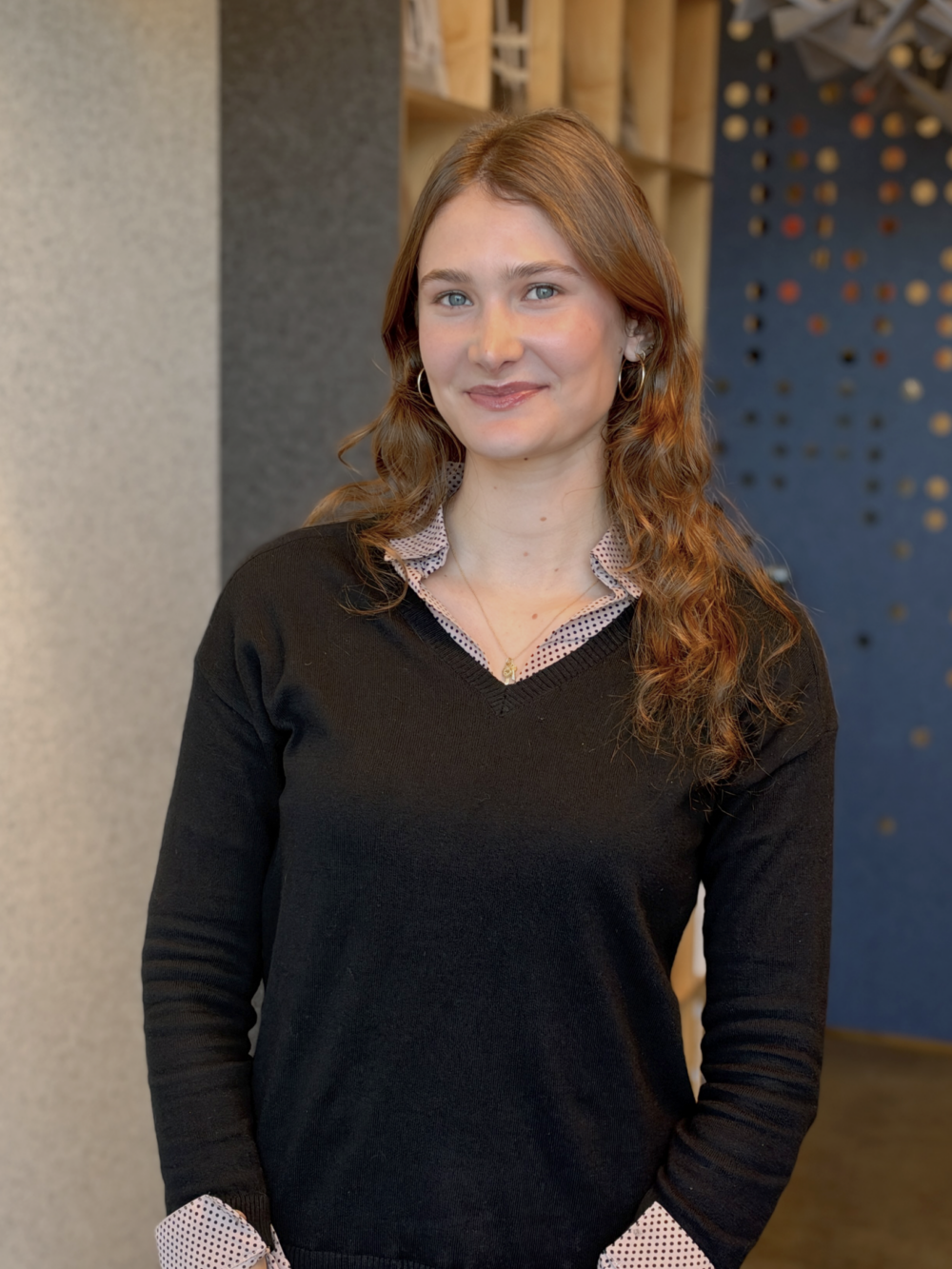 Portrait of Jamie Paxton smiling in office.